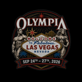 A circular embroidered patch design featuring the word 'OLYMPIA' at the top, a 'Welcome to Fabulous Las Vegas Nevada' sign in the center, two muscular female bodybuilders flanking the scene, and a red ribbon at the bottom reading 'SEP 24TH - 27TH, 2026'. The patch is shown on a solid black background.