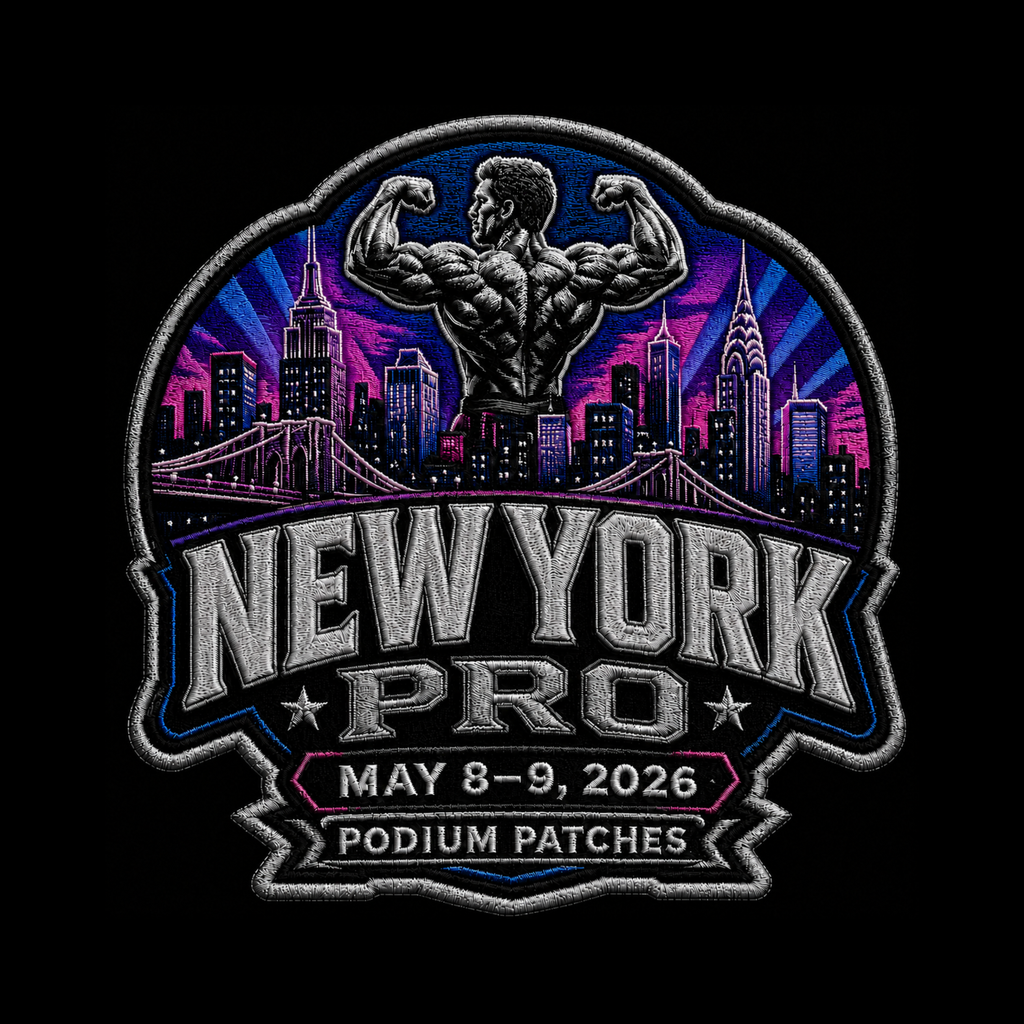 An embroidered patch design featuring a muscular flexing figure above a New York City skyline with a bridge, set against a purple and blue sunburst background. Large text reads 'NEW YORK PRO' with a banner below reading 'MAY 8-9, 2026' and 'PODIUM PATCHES'.
